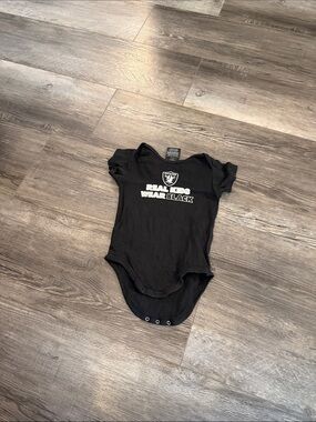 NFL Oakland Raiders 'Real Kids Wear Black' Black Baby One-Piece